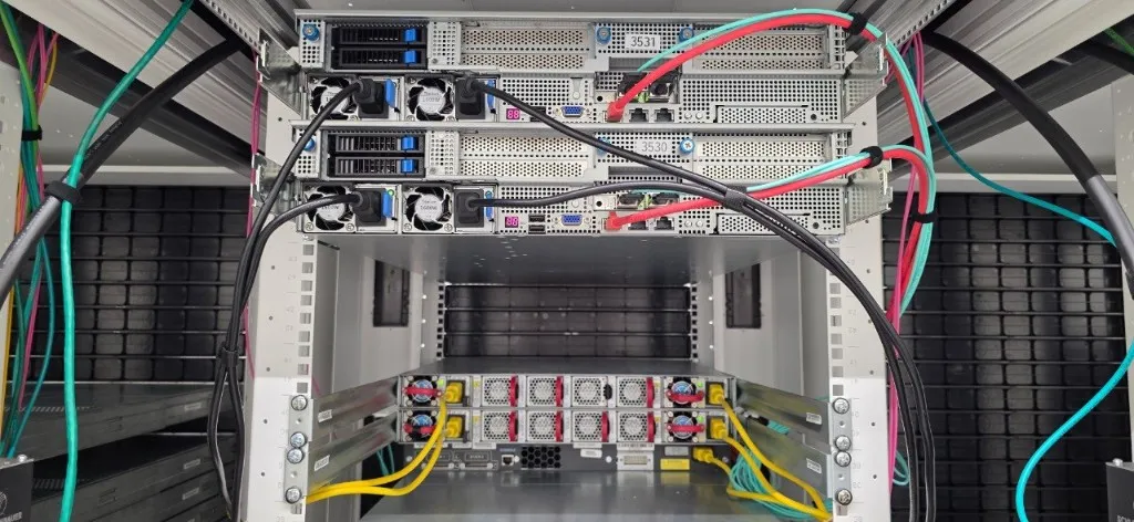 The same rack from the rear, showing power supplies and network cabling.